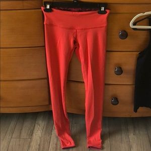 Lululemon size 4 REVERSIBLE red/orange leggings
